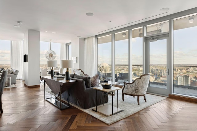 living room with dark parquet flooring and plenty of natural light