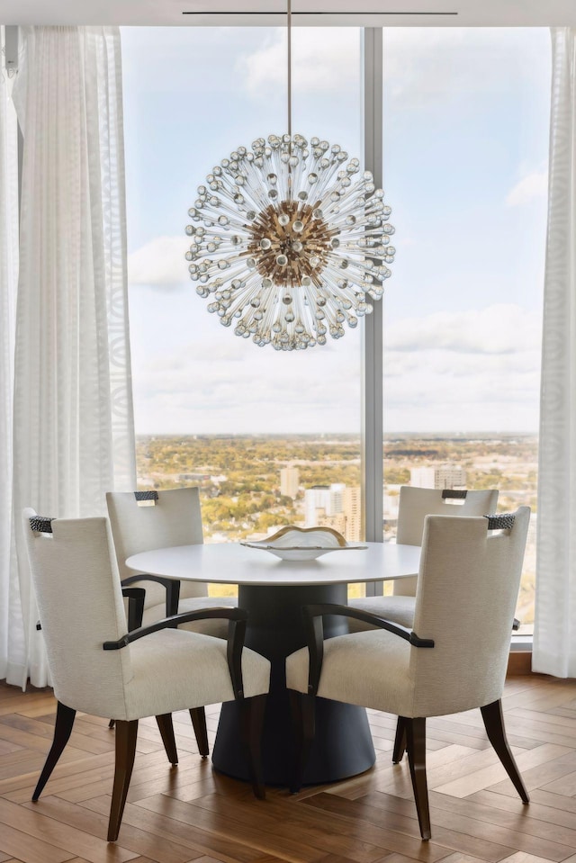 dining space featuring a notable chandelier and wood-type flooring