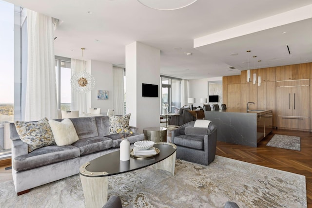 living room with parquet flooring and sink