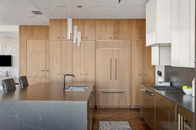 kitchen featuring white cabinetry, dark parquet flooring, sink, and beverage cooler