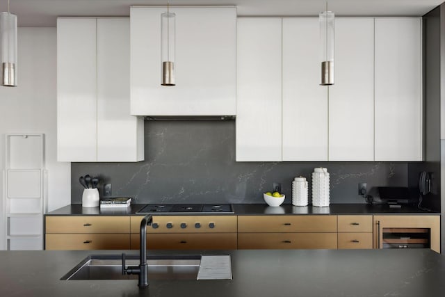 255 Hennepin Ave Unit 3402, Minneapolis, MN 55401 - kitchen with dark countertops, modern cabinets, white cabinets, and decorative backsplash