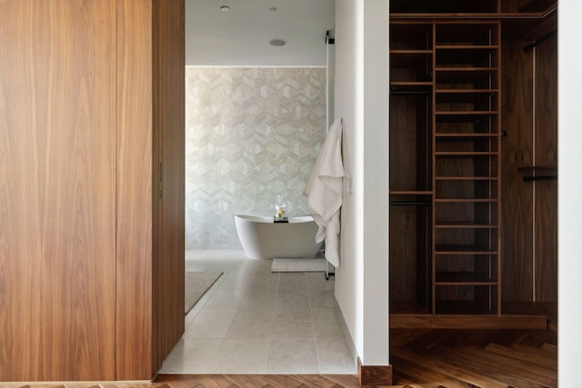 255 Hennepin Ave Unit 3402, Minneapolis, MN 55401 - full bath with a freestanding tub, wallpapered walls, and an accent wall