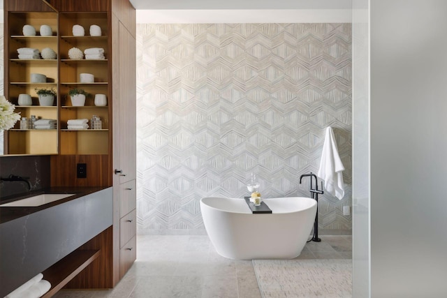 255 Hennepin Ave Unit 3402, Minneapolis, MN 55401 - bathroom with a freestanding bath, tile walls, tile patterned flooring, and vanity