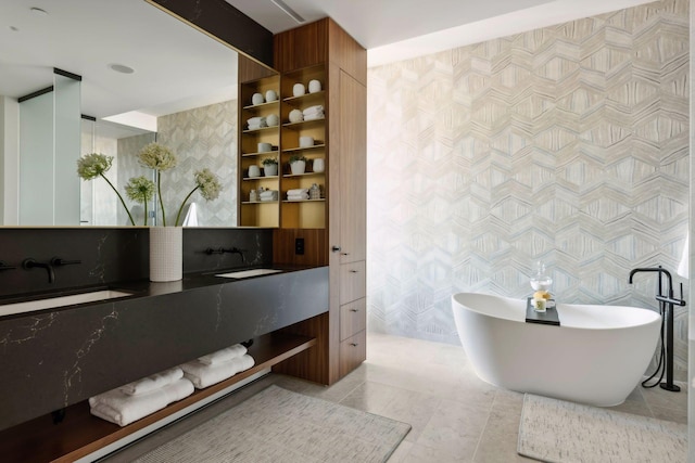255 Hennepin Ave Unit 3402, Minneapolis, MN 55401 - bathroom with wallpapered walls, tile walls, tile patterned flooring, a freestanding tub, and vanity