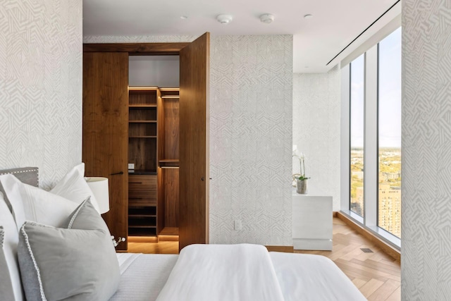 255 Hennepin Ave Unit 3402, Minneapolis, MN 55401 - bedroom with wallpapered walls and floor to ceiling windows