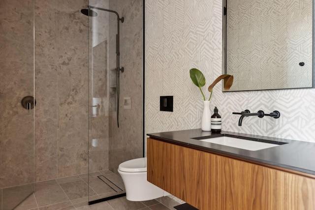 255 Hennepin Ave Unit 3402, Minneapolis, MN 55401 - bathroom with toilet, tiled shower, wallpapered walls, and tile patterned floors