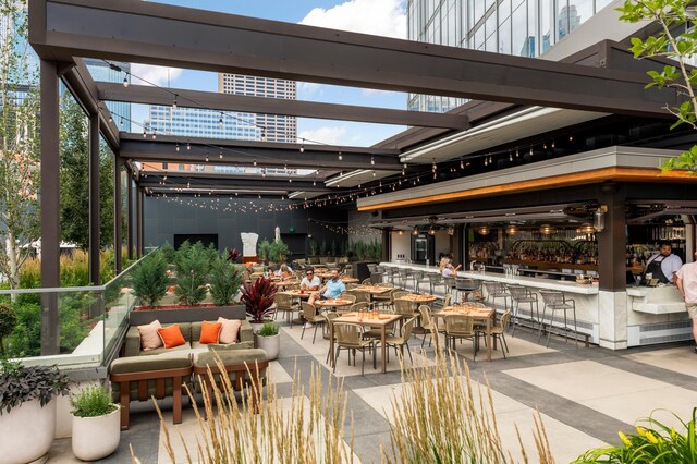 255 Hennepin Ave Unit 3402, Minneapolis, MN 55401 - exterior space with outdoor dining area, a pergola, and outdoor lounge area