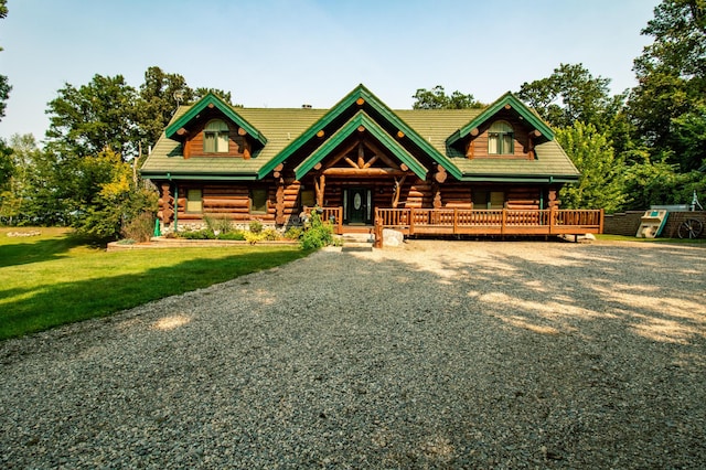 log-style house with a front yard