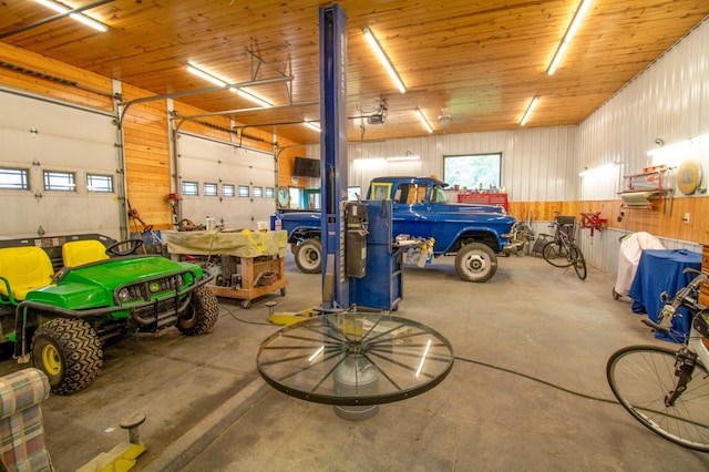 garage featuring wood ceiling and a garage door opener