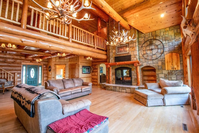 living room with high vaulted ceiling, hardwood / wood-style flooring, rustic walls, and wood ceiling