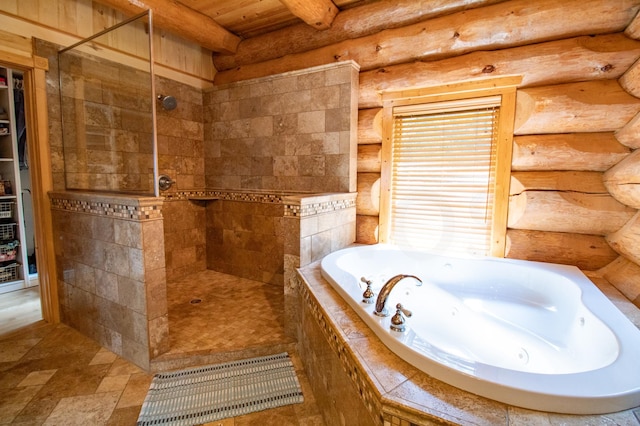 bathroom featuring rustic walls and plus walk in shower