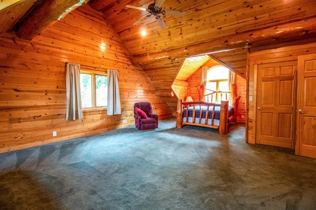 unfurnished bedroom with vaulted ceiling with beams, wood ceiling, wooden walls, and dark colored carpet