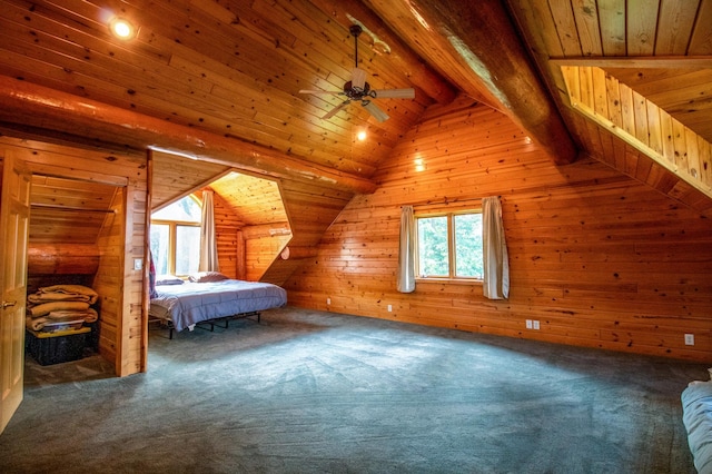 unfurnished bedroom featuring carpet, wooden walls, wood ceiling, and vaulted ceiling with beams