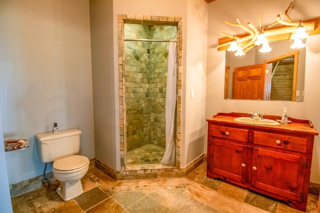 bathroom with toilet, vanity, and a shower with curtain