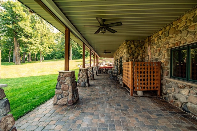 view of patio featuring ceiling fan