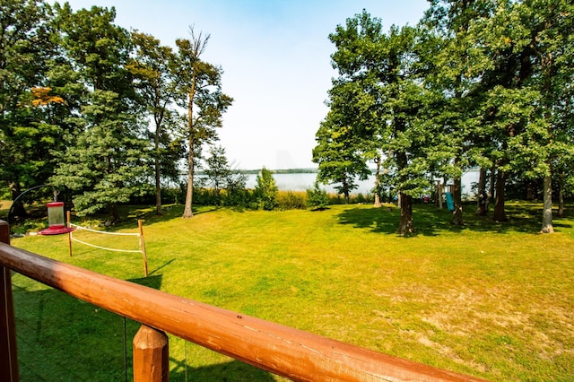 view of yard with a water view and volleyball court