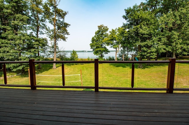 deck featuring a lawn and a water view