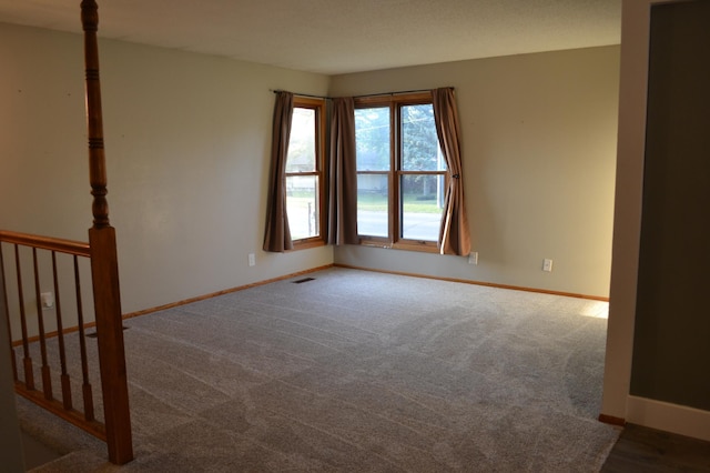 empty room with carpet flooring