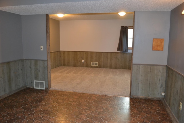 empty room with a textured ceiling