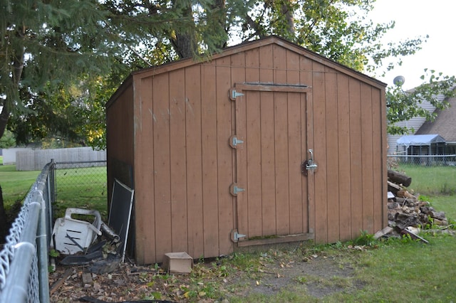 view of outdoor structure featuring a lawn