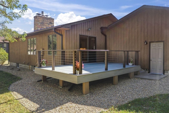 back of house with a wooden deck