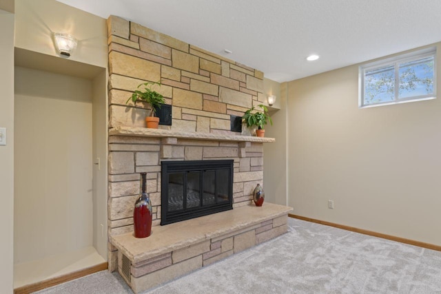 carpeted living room featuring a fireplace