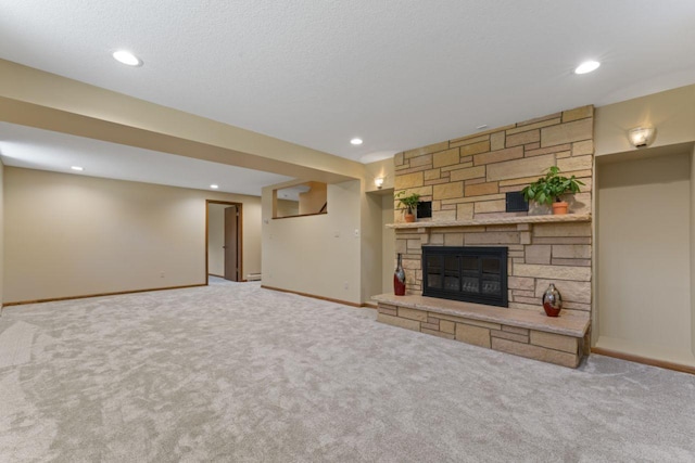 unfurnished living room with carpet flooring and a fireplace