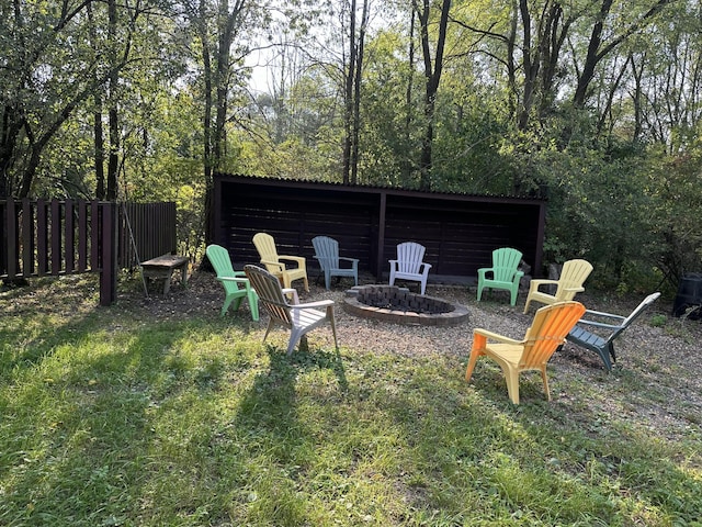 view of yard with an outdoor fire pit