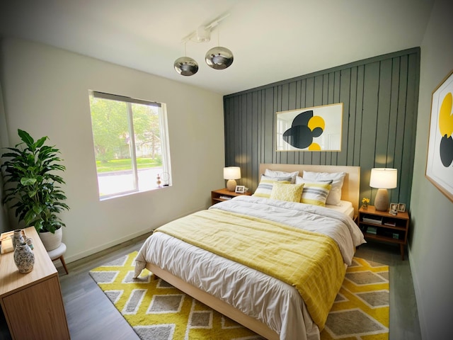 bedroom with wood-type flooring