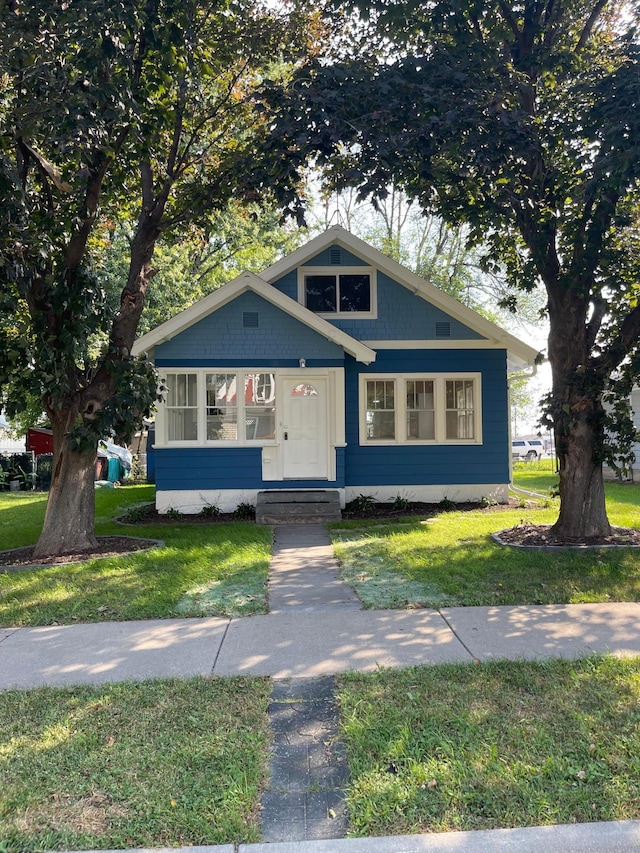 bungalow with a front yard