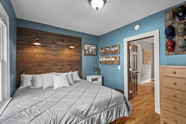3509 43rd Ave S, Minneapolis, MN 55406 - bedroom featuring light wood-style floors and a textured ceiling