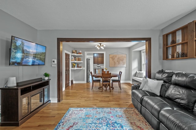 3509 43rd Ave S, Minneapolis, MN 55406 - living area with light wood-type flooring and a textured ceiling