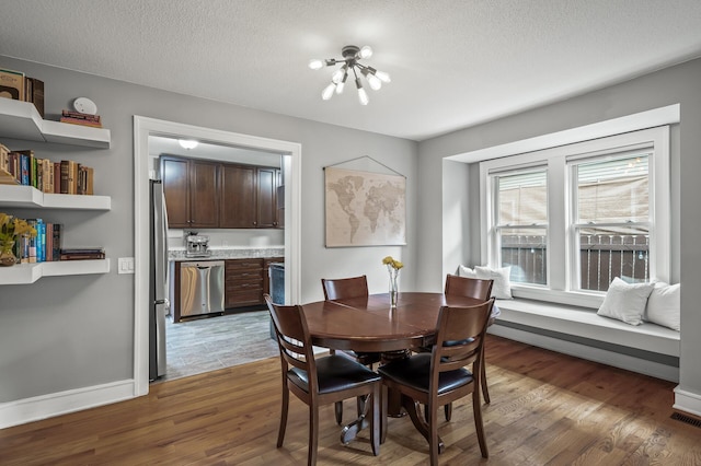 3509 43rd Ave S, Minneapolis, MN 55406 - dining space featuring wood finished floors and a textured ceiling