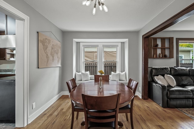 3509 43rd Ave S, Minneapolis, MN 55406 - dining area with light wood-style flooring and a chandelier