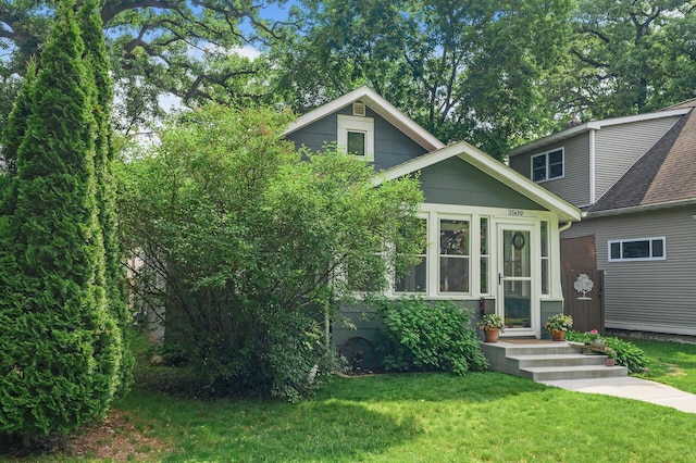 3509 43rd Ave S, Minneapolis, MN 55406 - view of front of home featuring a front yard and a shingled roof