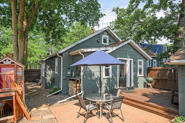 3509 43rd Ave S, Minneapolis, MN 55406 - back of house featuring a fenced backyard, a deck, outdoor dining area, and a patio