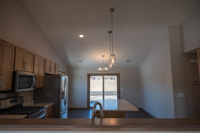 kitchen featuring lofted ceiling, sink, stainless steel appliances, decorative light fixtures, and a chandelier