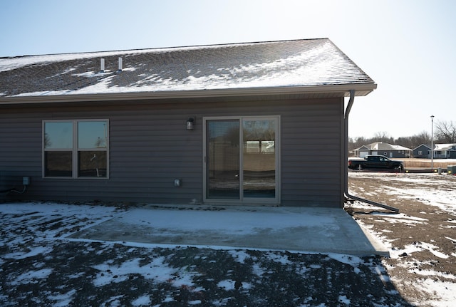 view of snow covered house