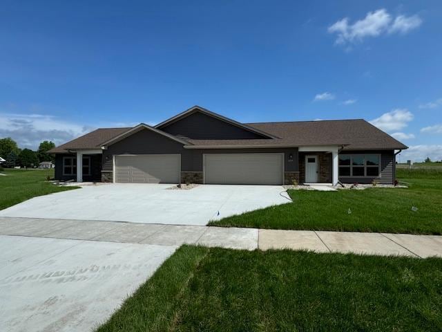 2218 Red Bird Ln, Fairmont, MN 56031 - single story home featuring concrete driveway, an attached garage, and a front yard
