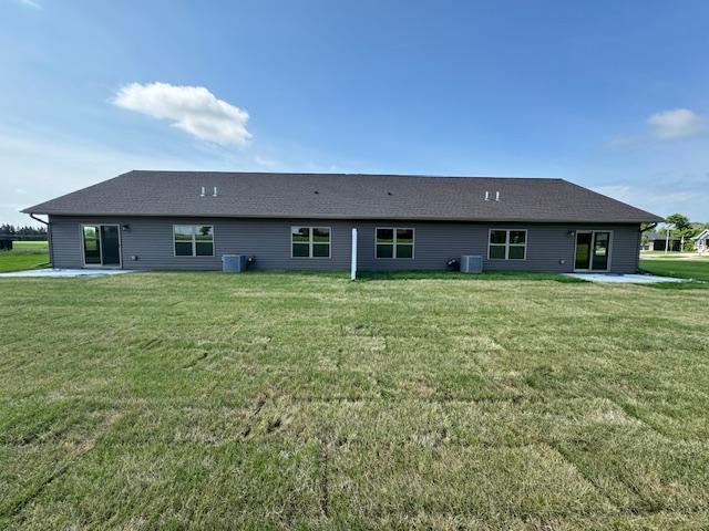 2218 Red Bird Ln, Fairmont, MN 56031 - rear view of house with a lawn and a patio area