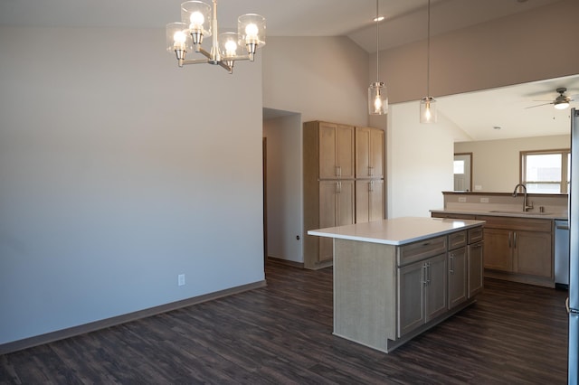 2218 Red Bird Ln, Fairmont, MN 56031 - kitchen featuring dark wood-style floors, a center island, light countertops, ceiling fan, and pendant lighting
