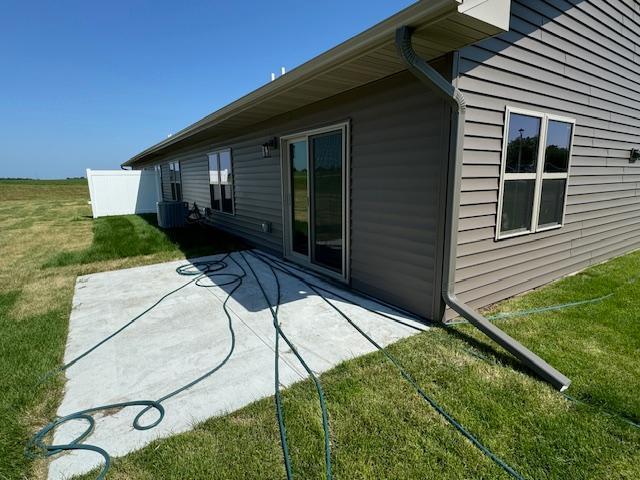 2218 Red Bird Ln, Fairmont, MN 56031 - back of property featuring a patio area and a yard