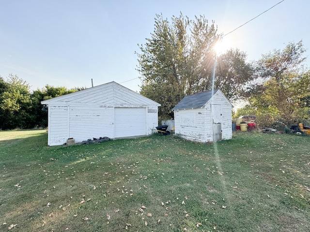 garage featuring a yard