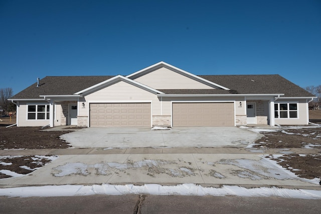 ranch-style home featuring a garage