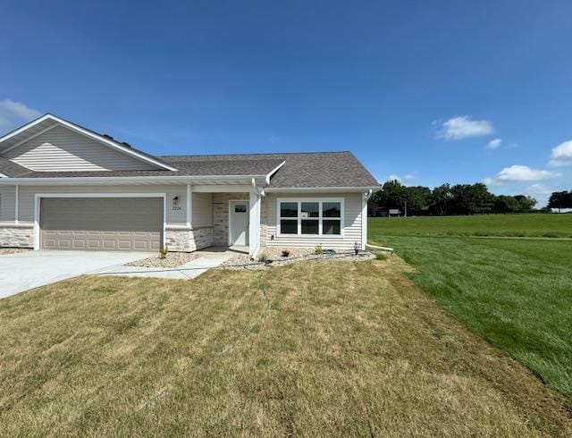 2224 Red Bird Ln, Fairmont, MN 56031 - view of front of property featuring a garage, a front lawn, and driveway