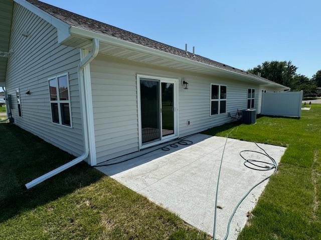2224 Red Bird Ln, Fairmont, MN 56031 - back of house featuring a lawn and a patio