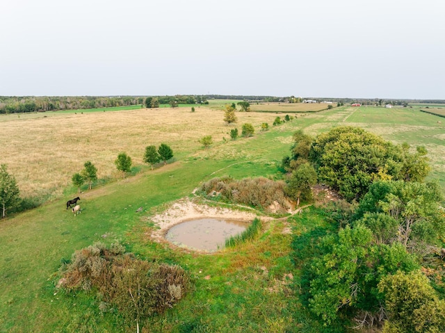 birds eye view of property with a rural view