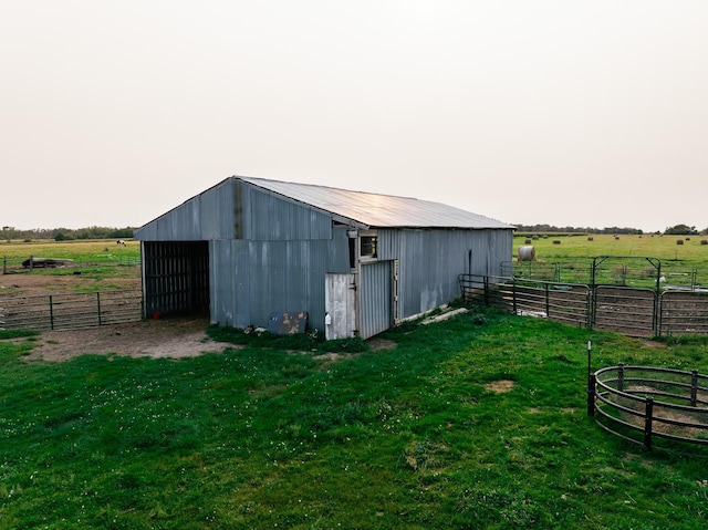 view of outdoor structure with a rural view