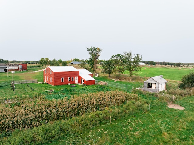 view of yard with a rural view and an outdoor structure