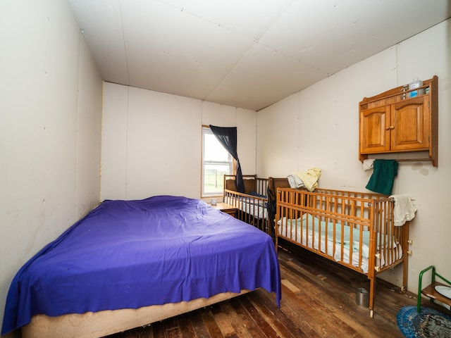 bedroom featuring dark wood-type flooring